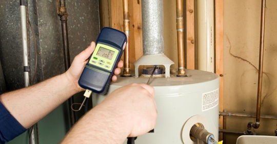technician checking water heater